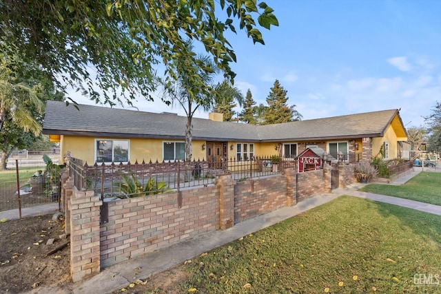 253 E Mckee Rd, Bakersfield, CA 93307 - ranch-style home featuring stucco siding, a chimney, and a fenced front yard