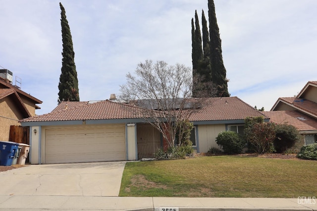 2605 Puder St, Bakersfield, CA 93306 - ranch-style home featuring a tiled roof, an attached garage, a chimney, and driveway