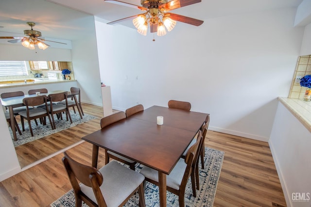 14500 Las Palmas Dr Unit 3, Bakersfield, CA 93306 - dining room featuring ceiling fan and light wood-style flooring
