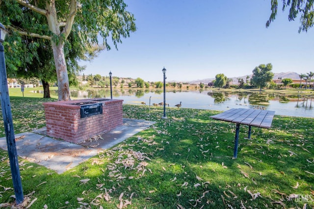 14500 Las Palmas Dr Unit 3, Bakersfield, CA 93306 - view of home's community with a water view and a lawn