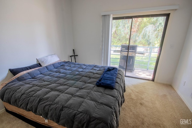 14500 Las Palmas Dr Unit 3, Bakersfield, CA 93306 - carpeted bedroom featuring access to exterior and baseboards