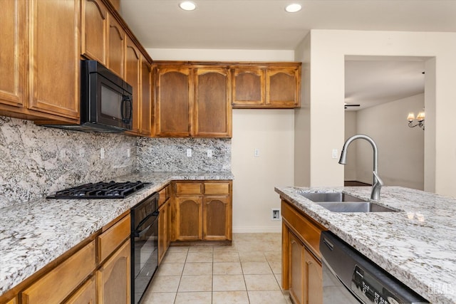 9711 Boothbay Harbour Dr, Bakersfield, CA 93314 - kitchen featuring a sink, black appliances, decorative backsplash, brown cabinetry, and light stone countertops