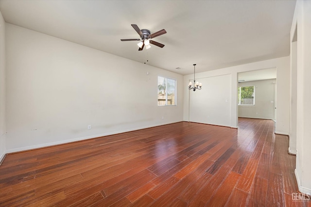 9711 Boothbay Harbour Dr, Bakersfield, CA 93314 - unfurnished room featuring ceiling fan, wood finished floors, a chandelier, and healthy amount of natural light
