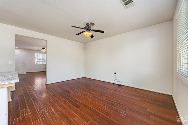 9711 Boothbay Harbour Dr, Bakersfield, CA 93314 - unfurnished room featuring a ceiling fan, dark wood finished floors, and baseboards