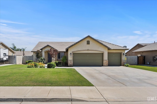 9711 Boothbay Harbour Dr, Bakersfield, CA 93314 - view of front facade featuring an attached garage, concrete driveway, stucco siding, stone siding, and a tile roof