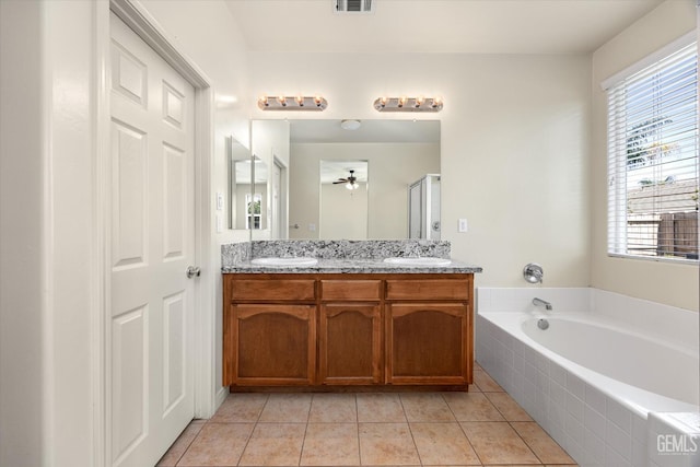 9711 Boothbay Harbour Dr, Bakersfield, CA 93314 - bathroom featuring a bath, double vanity, plenty of natural light, and tile patterned flooring