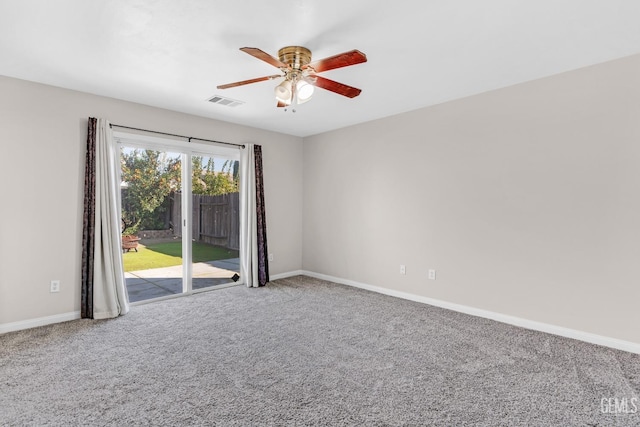 carpeted empty room featuring ceiling fan