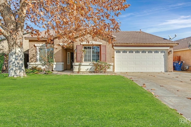 view of front facade with a front yard and a garage