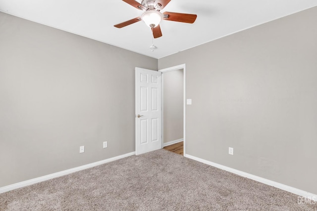 unfurnished room with carpet and ceiling fan