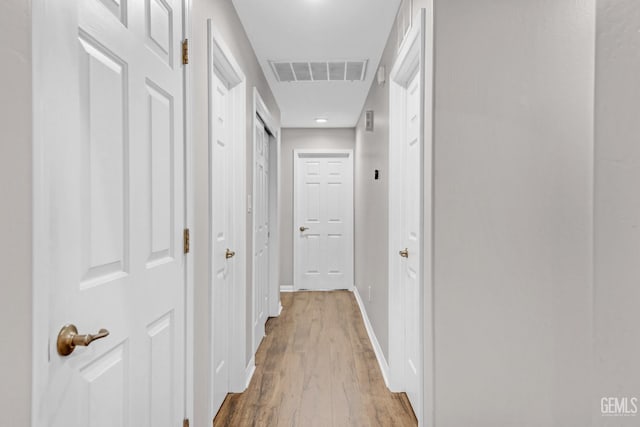 hallway featuring hardwood / wood-style flooring