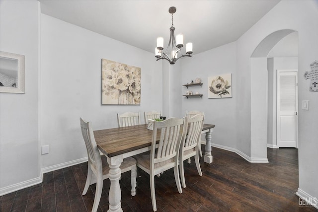 5812 Seasons Valley Ct, Bakersfield, CA 93313 - dining room with arched walkways, wood finished floors, and a chandelier