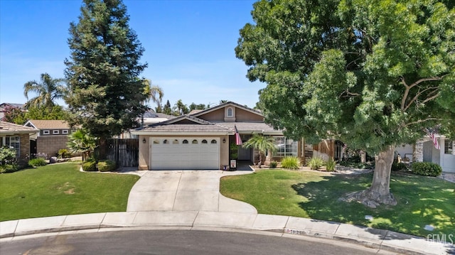 5812 Seasons Valley Ct, Bakersfield, CA 93313 - view of front of house with an attached garage, driveway, a tiled roof, and stucco siding