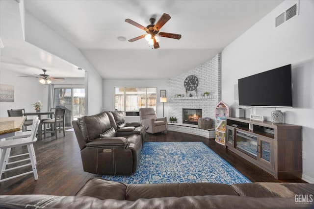 5812 Seasons Valley Ct, Bakersfield, CA 93313 - living area with a ceiling fan, vaulted ceiling, a fireplace, and wood finished floors