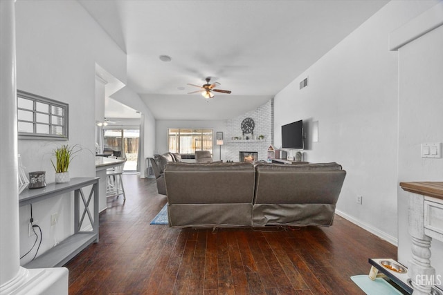 5812 Seasons Valley Ct, Bakersfield, CA 93313 - living room with a brick fireplace, a ceiling fan, and wood-type flooring