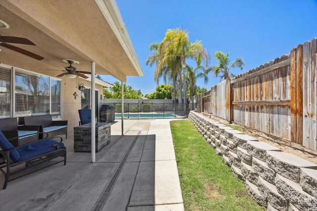5812 Seasons Valley Ct, Bakersfield, CA 93313 - fenced backyard featuring ceiling fan, a patio area, and outdoor lounge area
