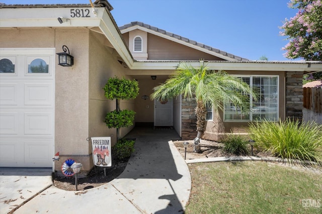 5812 Seasons Valley Ct, Bakersfield, CA 93313 - entrance to property featuring stone siding, stucco siding, and a tile roof