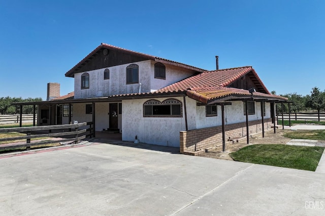 12606 Stradley Ave, Mc Farland, CA 93250 - view of front of home with stucco siding and an exterior structure