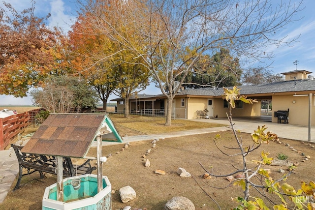 rear view of property with a patio area