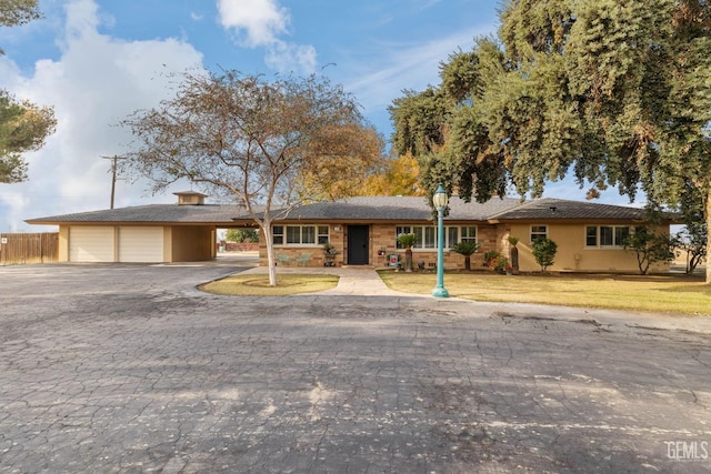 ranch-style home with a front yard