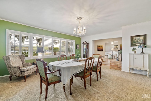 carpeted dining room featuring a notable chandelier