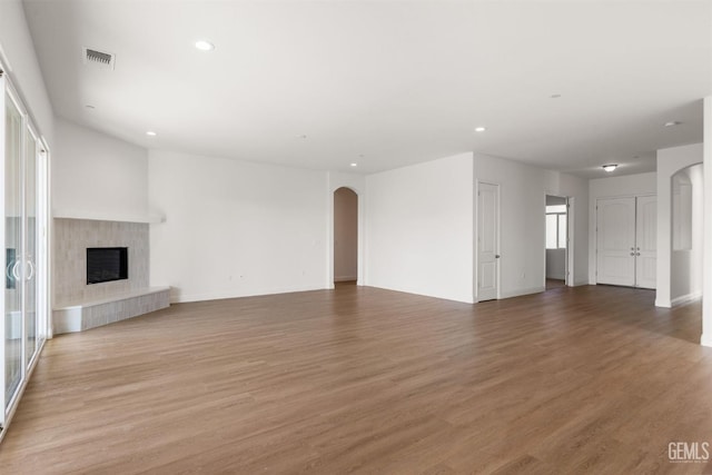 unfurnished living room featuring light hardwood / wood-style floors