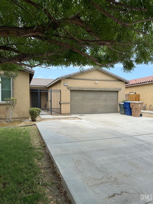 6511 Epley Ct, Bakersfield, CA 93313 - view of front of property featuring stucco siding, a garage, and concrete driveway
