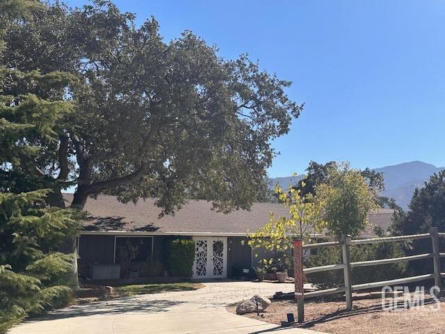 view of front of home featuring a mountain view