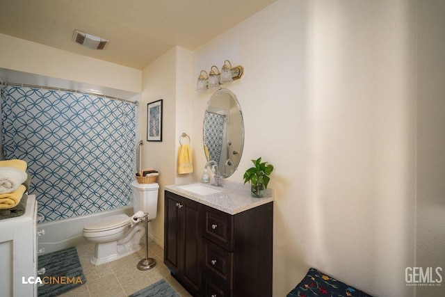 full bathroom with tile patterned flooring, vanity, shower / tub combo, and toilet