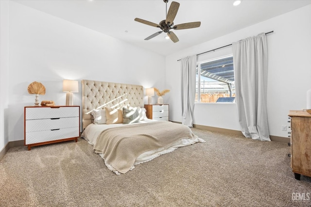 bedroom with carpet flooring, ceiling fan, and vaulted ceiling