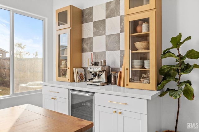 bar featuring white cabinets and wine cooler