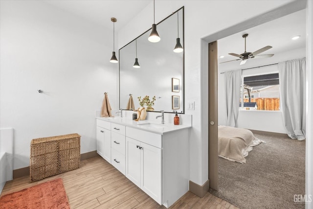 bathroom featuring ceiling fan and vanity