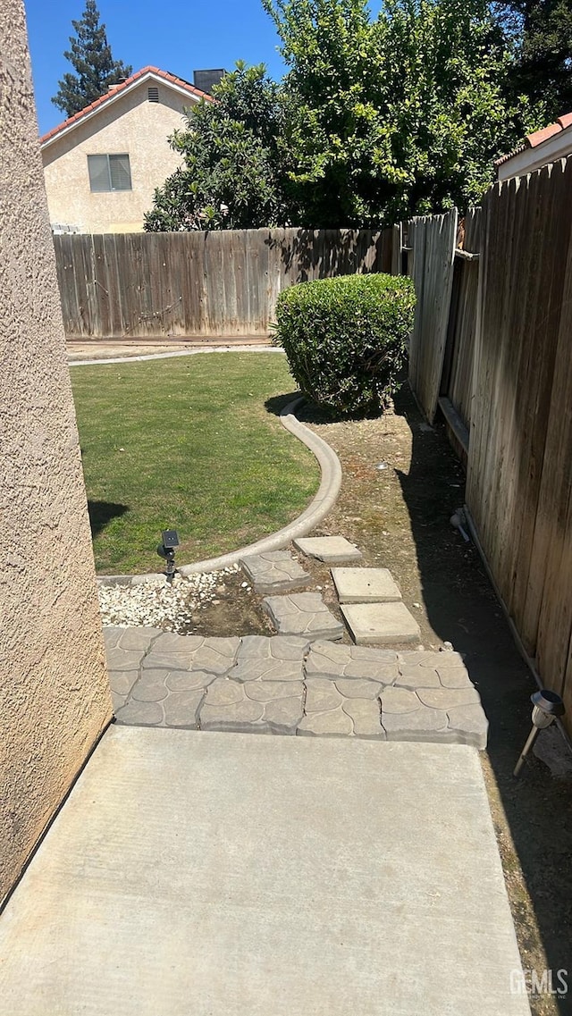 6308 Ambergrove St, Bakersfield, CA 93313 - fenced backyard featuring a patio area