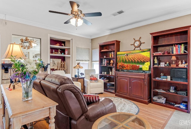 5510 Edge Water Ct, Bakersfield, CA 93312 - living room with a ceiling fan, built in shelves, ornamental molding, and light wood finished floors