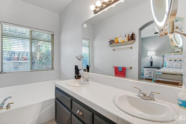 5510 Edge Water Ct, Bakersfield, CA 93312 - bathroom featuring connected bathroom, a garden tub, and double vanity
