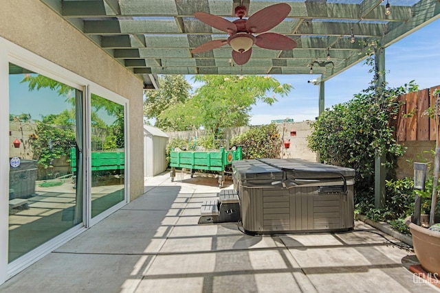 5510 Edge Water Ct, Bakersfield, CA 93312 - fenced backyard featuring a hot tub, a patio, and a ceiling fan