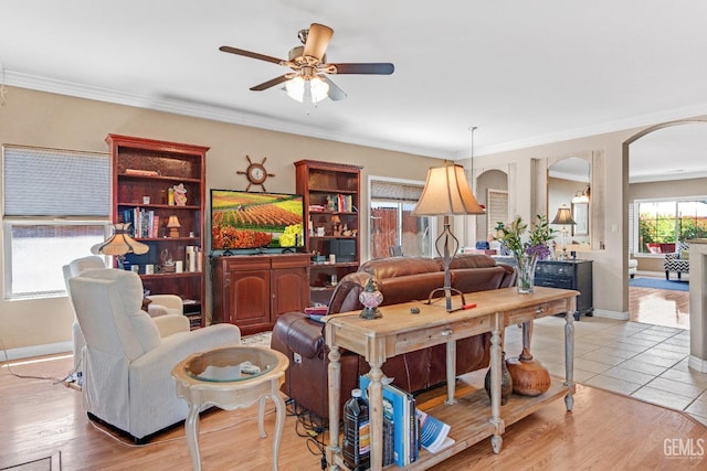 5510 Edge Water Ct, Bakersfield, CA 93312 - living area with ceiling fan, arched walkways, and crown molding