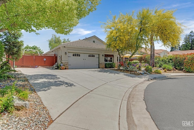 5510 Edge Water Ct, Bakersfield, CA 93312 - view of front of property with a garage, driveway, stucco siding, and a gate