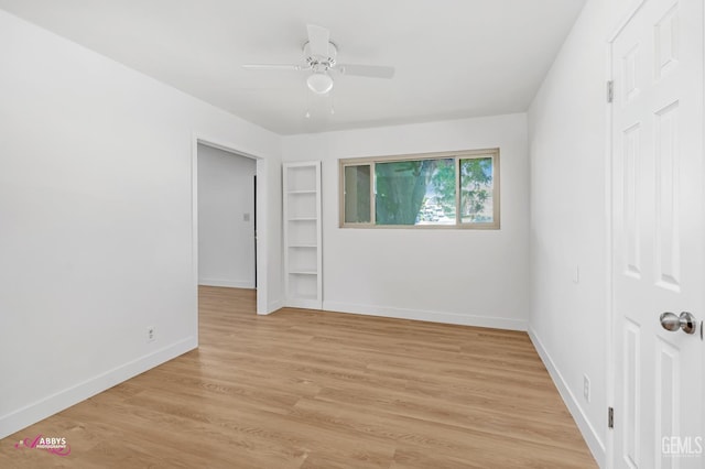 1825 Camino Primavera, Bakersfield, CA 93306 - unfurnished room with a ceiling fan, built in features, and light wood-style flooring