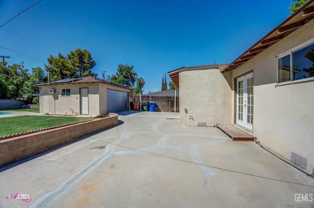 1825 Camino Primavera, Bakersfield, CA 93306 - view of patio with french doors and a garage
