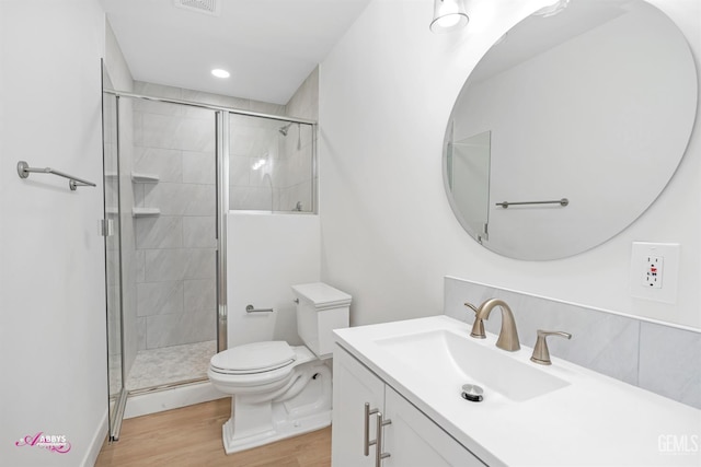 1825 Camino Primavera, Bakersfield, CA 93306 - bathroom with wood finished floors, vanity, a shower stall, and recessed lighting