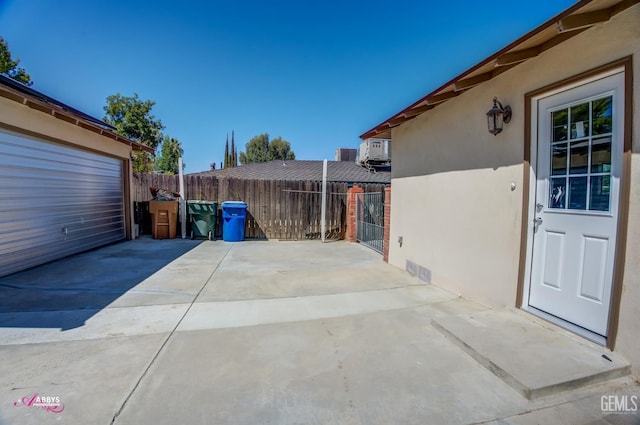 1825 Camino Primavera, Bakersfield, CA 93306 - view of patio featuring a garage