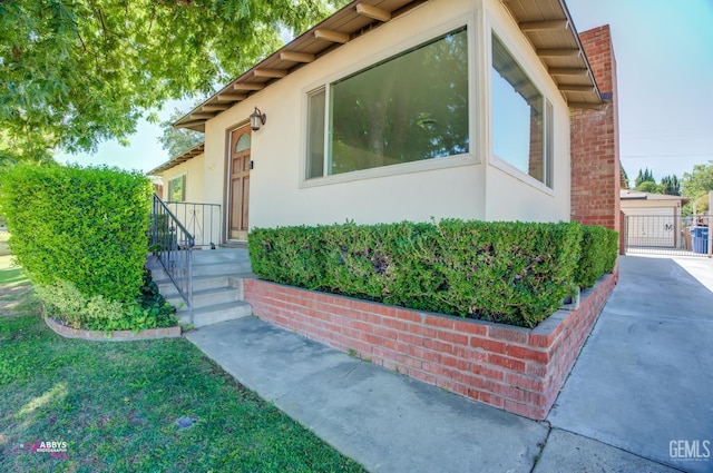 1825 Camino Primavera, Bakersfield, CA 93306 - view of front of home with stucco siding and a chimney