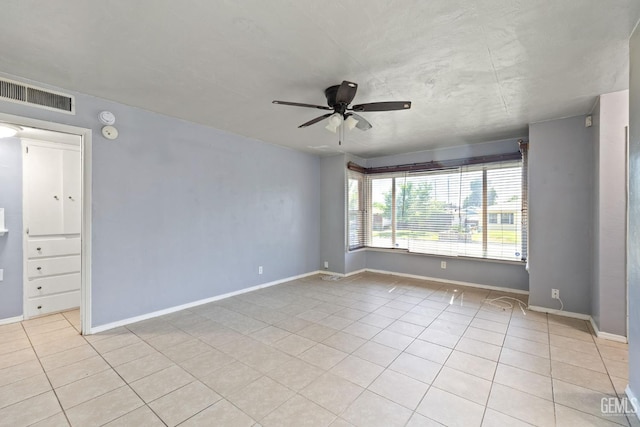 1805 Morgan Ln, Bakersfield, CA 93306 - unfurnished room with ceiling fan, light tile patterned floors, and baseboards