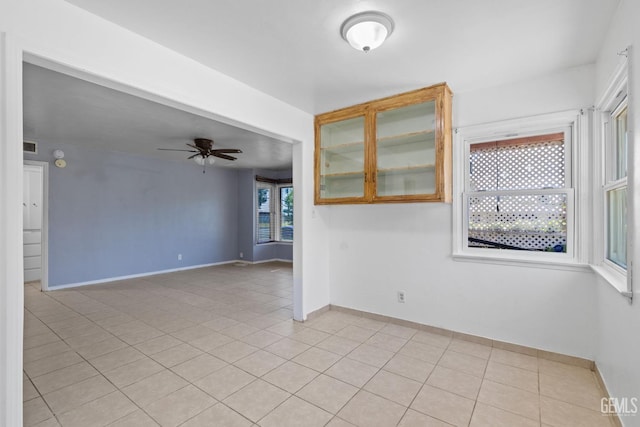 1805 Morgan Ln, Bakersfield, CA 93306 - unfurnished room with baseboards, a ceiling fan, and light tile patterned floors