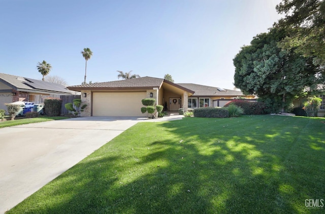 ranch-style home featuring a front yard, concrete driveway, and a garage