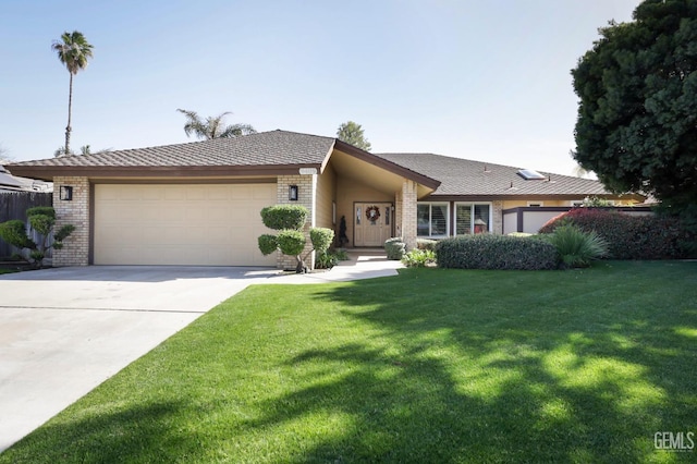 view of front of property featuring a front yard, brick siding, concrete driveway, and an attached garage