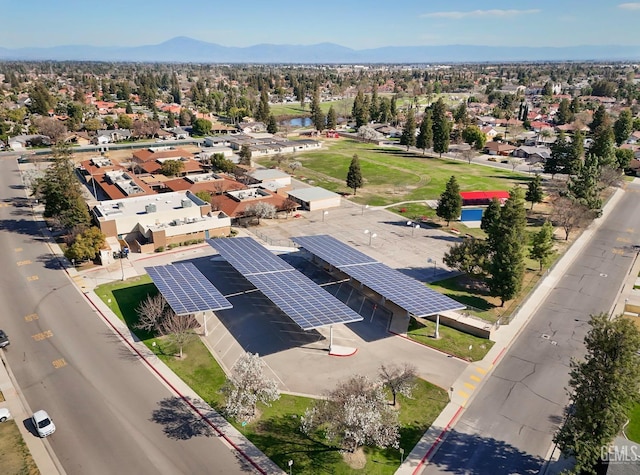 birds eye view of property with a mountain view and a residential view