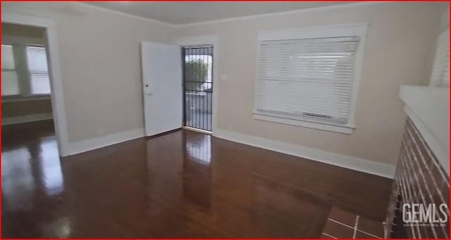 spare room featuring baseboards
