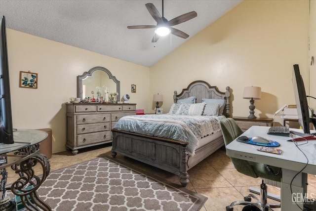 bedroom featuring vaulted ceiling, ceiling fan, light tile patterned floors, and a textured ceiling