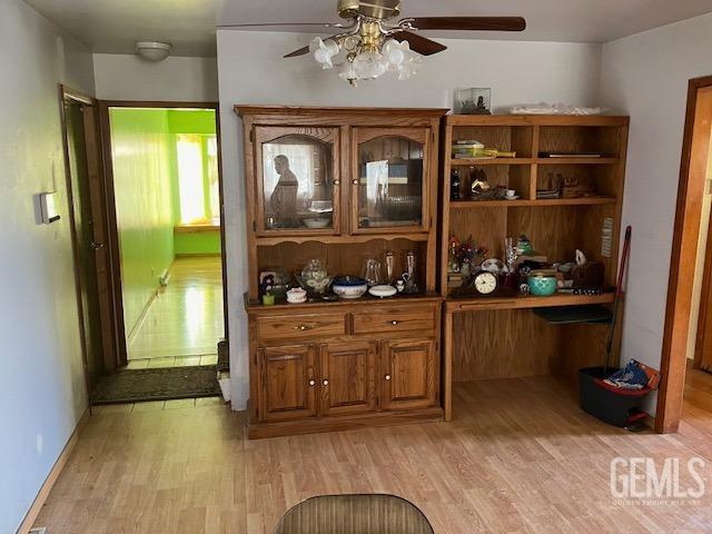 6419 Ringsdale Ct, Bakersfield, CA 93313 - bar with light wood-type flooring and ceiling fan